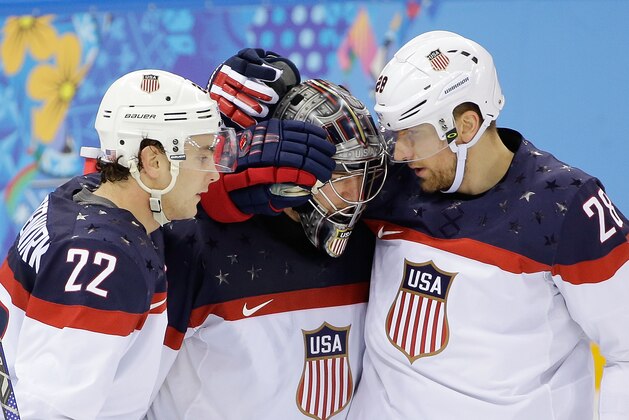USA defenseman Kevin Shattenkirk, goaltender Jonathan Quick and forward Blake Wheeler celebrate their 5-2 win over the Czech Republic after the men's quarterfinal hockey game in Shayba Arena at the 2014 Winter Olympics, Wednesday, Feb. 19, 2014, in Sochi, Russia. (AP Photo/David J. Phillip )