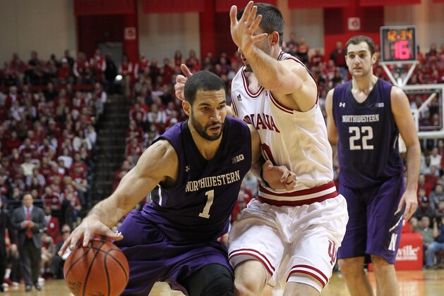Jan 18, 2014; Bloomington, IN, USA; Northwestern Wildcats guard/forward Drew Crawford (1) drives to the basket with Indiana Hoosiers forward Will Sheehey (0) defending during the second half at Assembly Hall. Northwestern won 54-47. Mandatory Credit: Pat Lovell-USA TODAY Sports