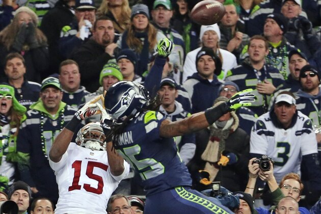 FILE - In this Jan. 19, 2014, file photo, Seattle Seahawks' Richard Sherman (25) tips a pass in the end zone intended for San Francisco 49ers' Michael Crabtree (15) in the final minute of the second half of the NFC championship NFL football game in Seattle. Seattle's Malcolm Smith intercepted the tipped pass. Sherman was fined $7,875 for unsportsmanlike conduct/taunting after he made a choking gesture after the play toward the San Francisco bench that he said was directed at quarterback Colin Kaepernick. (AP Photo/Matt Slocum, File)