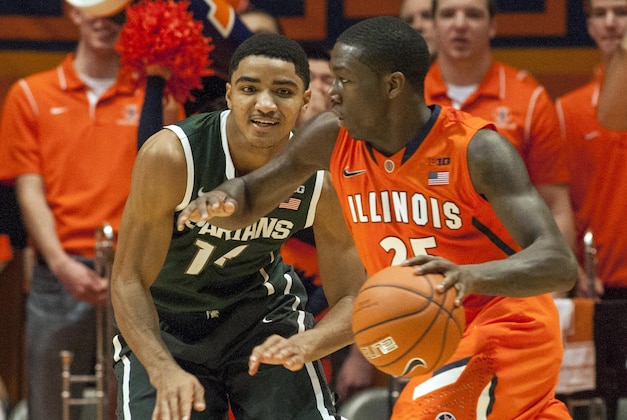 Jan 18, 2014; Champaign, IL, USA; Illinois Fighting Illini guard Kendrick Nunn (25) dribbles the ball while guarded by Michigan State Spartans guard Gary Harris (14) in the second half of the game at State Farm Center. The Michigan State Spartans beat the Illinois Fighting Illini 78-62. Mandatory Credit: Trevor Ruszkowksi-USA TODAY Sports