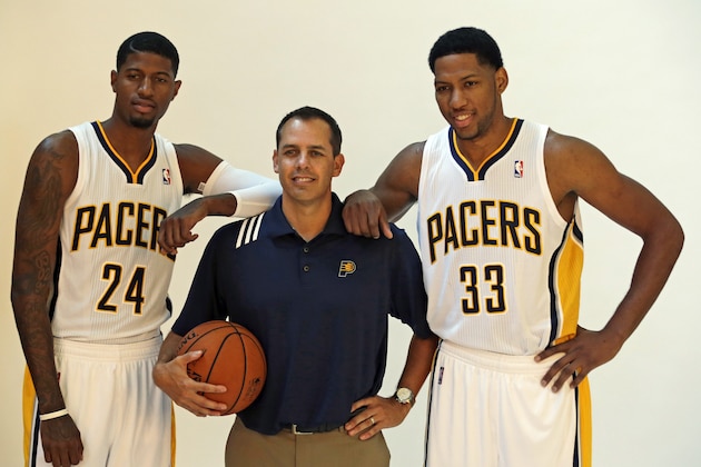 Indiana Pacers' Paul George, left, and Danny Granger, right, poses with head coach Frank Vogel during NBA basketball media day Friday, Sept. 27, 2013, in Indianapolis. (AP Photo/Darron Cummings)