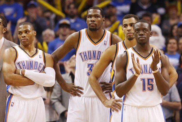 Oklahoma City Thunder guard Russell Westbrook (0), forward Kevin Durant (35), guard Thabo Sefolosha (25) and guard Reggie Jackson (15) wait for an offical's ruling in the fourth quarter of an NBA basketball game against the Orlando Magic in Oklahoma City, Sunday, Dec. 15, 2013. Oklahoma City won 101-98. (AP Photo/Sue Ogrocki) Oklahoma City Thunder guard Russell Westbrook (0), forward Kevin Durant (35), guard Thabo Sefolosha (25) and guard Reggie Jackson (15) wait for an offical's ruling in the fourth quarter of an NBA basketball game against the Orlando Magic in Oklahoma City, Sunday, Dec. 15, 2013. Oklahoma City won 101-98. (AP Photo/Sue Ogrocki)