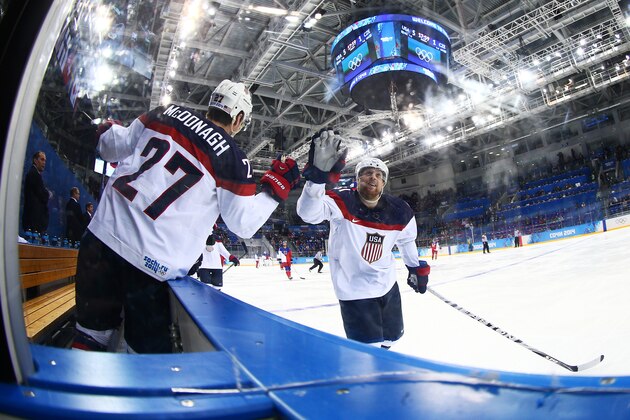 SOCHI, RUSSIA - FEBRUARY 19:  Phil Kessel #81 of the United States celebrates with teammate Ryan McDonagh #27 of the United States after scoring his team's fifth goal against the Czech Republic 53 in the third period during the Men's Ice Hockey Quarterfinal Playoff on Day 12 of the 2014 Sochi Winter Olympics at Shayba Arena on February 19, 2014 in Sochi, Russia.  (Photo by Clive Mason/Getty Images)