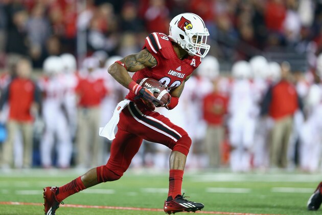 LOUISVILLE, KY - NOVEMBER 16:  Hakeem Smith #29 of the Louisville Cardinals runs with the ball after intercepting a pass during the game against the Houston Cougars at Papa John's Cardinal Stadium on November 16, 2013 in Louisville, Kentucky.  (Photo by Andy Lyons/Getty Images)