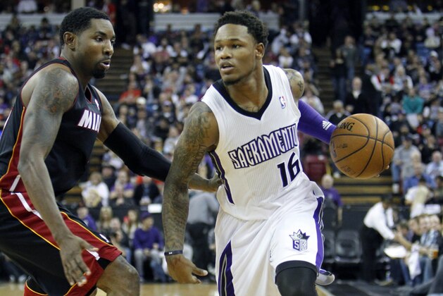 Sacramento Kings guard Ben McLemore (16) drives past Miami Heat defender Roger Mason Jr. during the second of an NBA basketball game in Sacramento, Calif., on Friday, Dec. 27, 2013.(AP Photo/Steve Yeater)