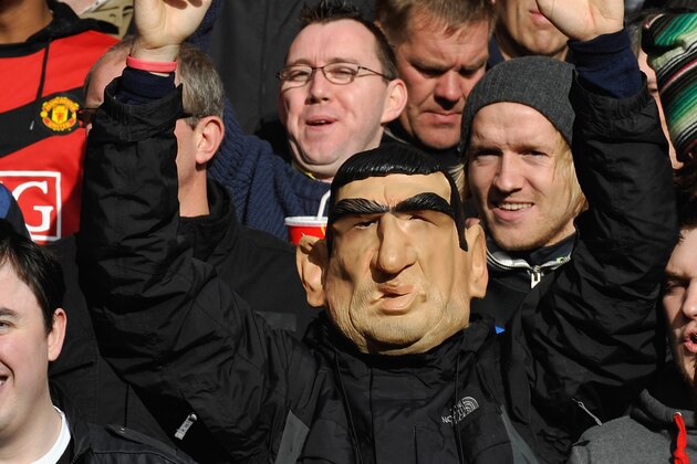 LIVERPOOL, ENGLAND - OCTOBER 25:  A Manchester United fan wearing an Eric Cantona mask shows his support during the Barclays Premier League match between Liverpool and Manchester United at Anfield on October 25, 2009 in Liverpool, England.  (Photo by Michael Regan/Getty Images)