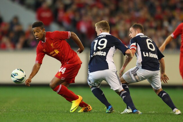 MELBOURNE, AUSTRALIA - JULY 24:  Connor Pain and Leigh Broxham of the Victory and Jordon Ibe of Liverpool compete for the ball during the match between the Melbourne Victory and Liverpool at the Melbourne Cricket Ground on July 24, 2013 in Melbourne, Australia.  (Photo by Scott Barbour/Getty Images)