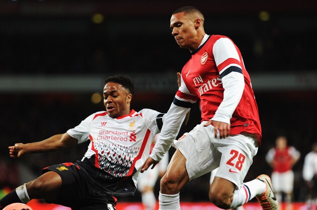 LONDON, ENGLAND - FEBRUARY 16:  (L-R) Raheem Sterling of Liverpool and Kieran Gibbs of Arsenal challenge for the ball during the FA Cup Fifth Round match between Arsenal and Liverpool at the Emirates Stadium on February 16, 2014 in London, England.  (Photo by Shaun Botterill/Getty Images)