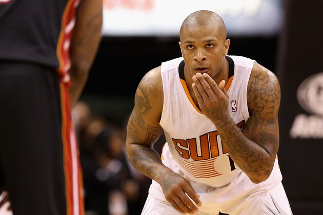 PHOENIX, AZ - FEBRUARY 11:  P.J. Tucker #17 of the Phoenix Suns during the NBA game against the Miami Heat at US Airways Center on February 11, 2014 in Phoenix, Arizona. The Heat defeated the Suns 103-97.  NOTE TO USER: User expressly acknowledges and agrees that, by downloading and or using this photograph, User is consenting to the terms and conditions of the Getty Images License Agreement.  (Photo by Christian Petersen/Getty Images)