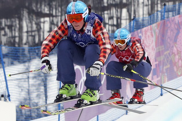 Canada's Marielle Thompson leads compatriot Kelsey Serwa in the women's ski cross final at the Rosa Khutor Extreme Park, at the 2014 Winter Olympics, Friday, Feb. 21, 2014, in Krasnaya Polyana, Russia. (AP Photo/Sergei Grits)