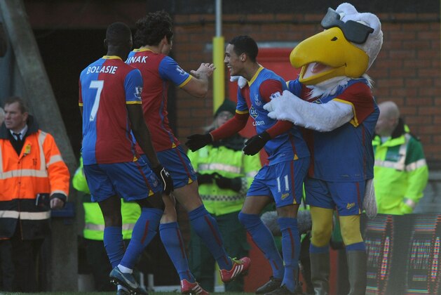LONDON, ENGLAND - FEBRUARY 08: Thomas Ince (C) of Crystal Palace celebrates scoring the first goal with his team-mates and their mascot Pete the Eagle during the Barclays Premier League match between Crystal Palace and West Bromwich Albion at Selhurst Park on February 8, 2014 in London, England.  (Photo by Steve Bardens/Getty Images)