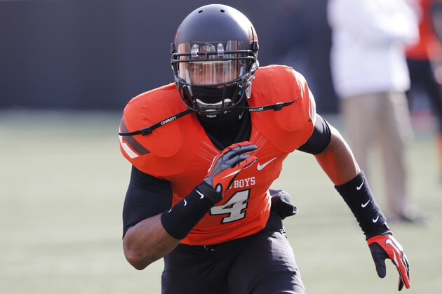 Oklahoma State cornerback Justin Gilbert (4) is pictured before the start of an NCAA college football game between Oklahoma State and Oklahoma in Stillwater, Okla., Saturday, Dec. 7, 2013. (AP Photo/Sue Ogrocki)