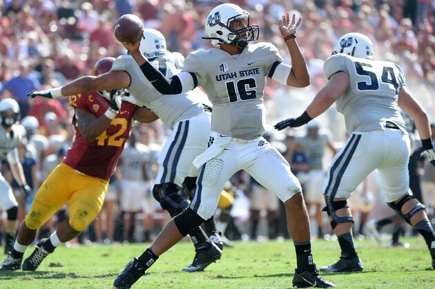 LOS ANGELES, CA - SEPTEMBER 21:  Chuckie Keeton #16 of the Utah State Aggies throws during the game against the USC Trojans at the Los Angeles Memorial Coliseum on September 21, 2013 in Los Angeles, California.  (Photo by Harry How/Getty Images)