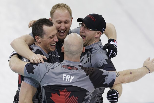 Canada's men's curling team as seen clockwise, Brad Jacobs, Ryan Harnden, Ryan Fry and E.J. Harnden celebrate after beating Britain to win the men's curling gold medal game at the 2014 Winter Olympics on Friday, Feb. 21, 2014, in Sochi, Russia. (AP Photo/Wong Maye-E)