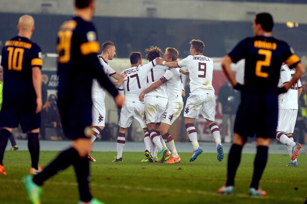 VERONA, ITALY - FEBRUARY 17:  Alessio Cerci of Torino FC is mobbed by team-mates after scoring his team's second goal during the Serie A match between Hellas Verona FC and Torino FC at Stadio Marc'Antonio Bentegodi on February 17, 2014 in Verona, Italy.  (Photo by Dino Panato/Getty Images)