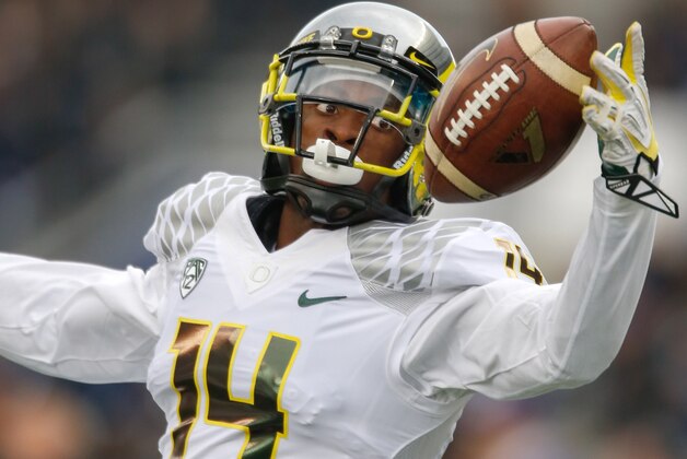 SEATTLE, WA - OCTOBER 12:  Cornerback Ifo Ekpre-Olomu #14 of the Oregon Ducks warms up prior to the game against the Washington Huskies on October 12, 2013 at Husky Stadium in Seattle, Washington.  (Photo by Otto Greule Jr/Getty Images)