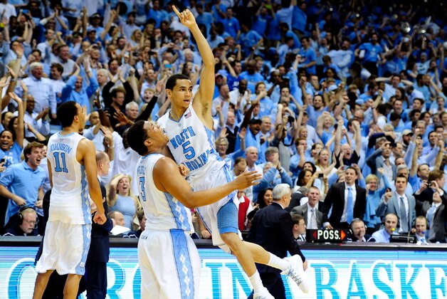 CHAPEL HILL, NC - FEBRUARY 20:  Kennedy Meeks #3 and Marcus Paige #5 of the North Carolina Tar Heels celebrate after a win over the Duke Blue Devils at the Dean Smith Center on February 20, 2014 in Chapel Hill, North Carolina. North Carolina won 74-66.  (Photo by Grant Halverson/Getty Images)