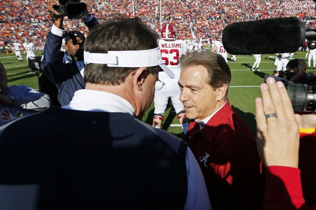 AUBURN, AL - NOVEMBER 30:  Head coach Gus Malzahn of the Auburn Tigers and head coach Nick Saban of the Alabama Crimson Tide shake hands prior to their game at Jordan-Hare Stadium on November 30, 2013 in Auburn, Alabama.  (Photo by Kevin C. Cox/Getty Images)