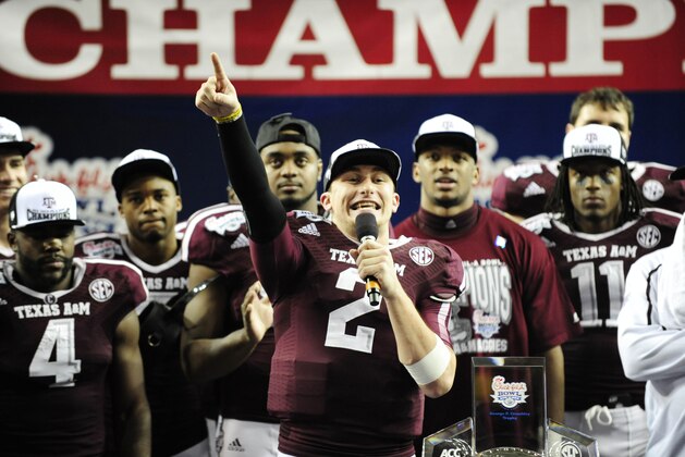Dec 31, 2013; Atlanta, GA, USA; Texas A&M Aggies quarterback Johnny Manziel (2) speaks to fans after the game against Duke Blue Devils in the 2013 Chick-fil-A Bowl at the Georgia Dome. The Aggies won 52-48. Mandatory Credit: Kevin Liles-USA TODAY Sports