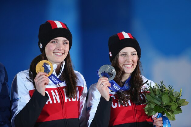 SOCHI, RUSSIA - FEBRUARY 21:  (L-R) Gold medallist Marielle Thompson of Canada and silver medalist Kelsey Serwa of Canada celebrate during the medal ceremony for the Women's Ski Cross on day fourteen of the Sochi 2014 Winter Olympics at Medals Plaza on February 21, 2014 in Sochi, Russia.  (Photo by Quinn Rooney/Getty Images)