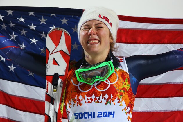 SOCHI, RUSSIA - FEBRUARY 21:  Gold medalist Mikaela Shiffrin of the United States celebrates during the flower ceremony for the Women's Slalom during day 14 of the Sochi 2014 Winter Olympics at Rosa Khutor Alpine Center on February 21, 2014 in Sochi, Russia.  (Photo by Doug Pensinger/Getty Images)
