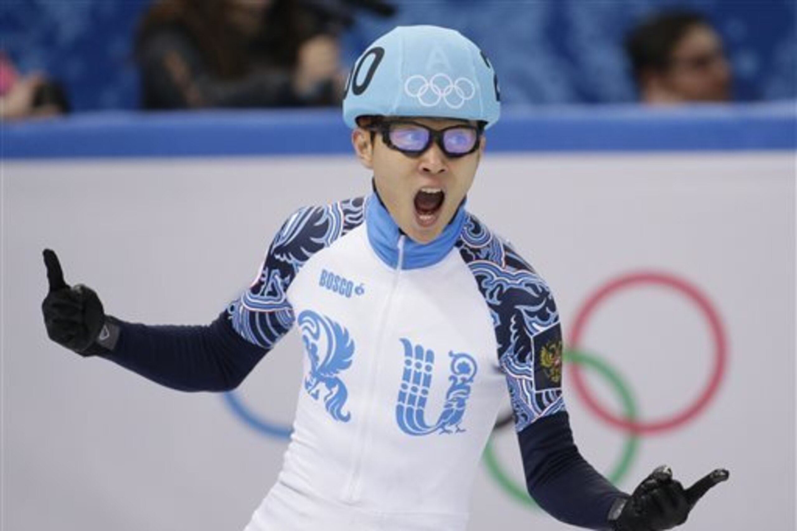 Victor An of Russia celebrates after his first place in the men's 500m short track speedskating final at the Iceberg Skating Palace during the 2014 Winter Olympics, Friday, Feb. 21, 2014, in Sochi, Russia. (AP Photo/Bernat Armangue)