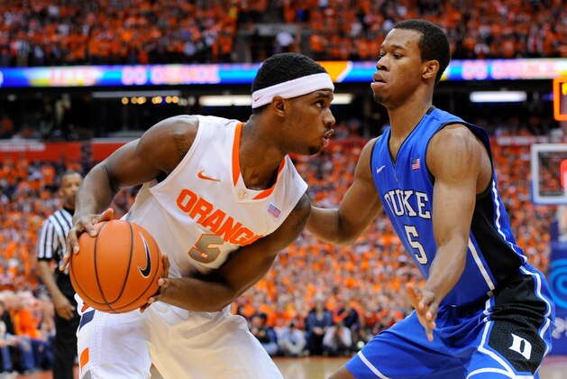 SYRACUSE, NY - FEBRUARY 01:  C.J. Fair #5 of the Syracuse Orange scans the court against the defense of Rodney Hood #5 of the Duke Blue Devils during the first half at the Carrier Dome on February 1, 2014 in Syracuse, New York.  Syracuse defeated Duke 91-89 in overtime.  (Photo by Rich Barnes/Getty Images)