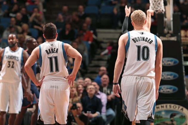 MINNEAPOLIS, MN - JANUARY 10:  J.J. Barea #11 and Chase Budinger #10 of the Minnesota Timberwolves walks up the court against the Charlotte Bobcats on January 10, 2014 at Target Center in Minneapolis, Minnesota. NOTE TO USER: User expressly acknowledges and agrees that, by downloading and or using this Photograph, user is consenting to the terms and conditions of the Getty Images License Agreement. Mandatory Copyright Notice: Copyright 2014 NBAE (Photo by Jordan Johnson/NBAE via Getty Images)
