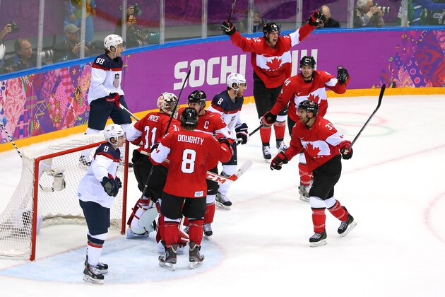 SOCHI, RUSSIA - FEBRUARY 21: Patrick Kane #88 and Zach Parise #9 of the United States react as Carey Price #31, Drew Doughty #8 and Sidney Crosby #87 of Canada celebrate after defeating the United States 1-0 during the Men's Ice Hockey Semifinal Playoff on Day 14 of the 2014 Sochi Winter Olympics at Bolshoy Ice Dome on February 21, 2014 in Sochi, Russia. (Photo by Julian Finney/Getty Images) SOCHI, RUSSIA - FEBRUARY 21: Patrick Kane #88 and Zach Parise #9 of the United States react as Carey Price #31, Drew Doughty #8 and Sidney Crosby #87 of Canada celebrate after defeating the United States 1-0 during the Men's Ice Hockey Semifinal Playoff on Day 14 of the 2014 Sochi Winter Olympics at Bolshoy Ice Dome on February 21, 2014 in Sochi, Russia. (Photo by Julian Finney/Getty Images)