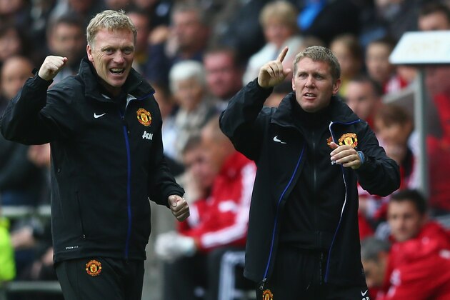 SWANSEA, WALES - AUGUST 17:  David Moyes (L) the manager of Manchester United celebrates his sides third goal alongside assistant Steve Round (R)  during the Barclays Premier League match between Swansea City and Manchester United at the Liberty Stadium on August 17, 2013 in Swansea, Wales.  (Photo by Michael Steele/Getty Images)