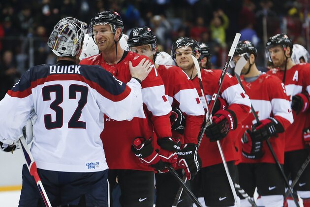 USA goaltender Jonathan Quick greets Canada forward Jeff Carter after Canada beat the USA 1-0 in a men's semifinal ice hockey game at the 2014 Winter Olympics, Friday, Feb. 21, 2014, in Sochi, Russia. (AP Photo/Petr David Josek)