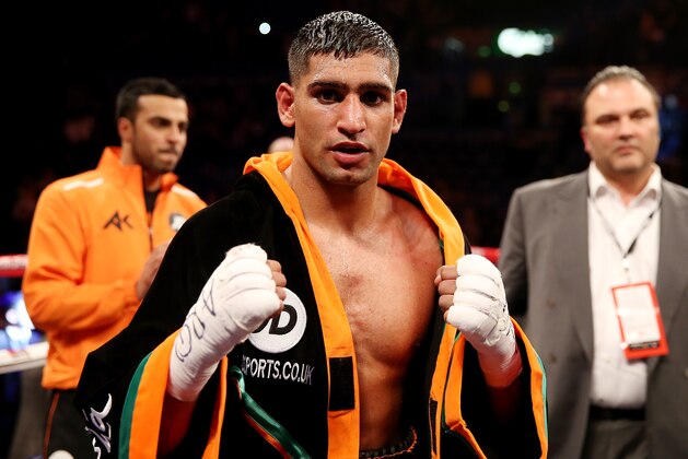 SHEFFIELD, ENGLAND - APRIL 27:  Amir Khan celebrates his victory over Julio Diaz at Motorpoint Arena on April 27, 2013 in Sheffield, England.  (Photo by Scott Heavey/Getty Images)