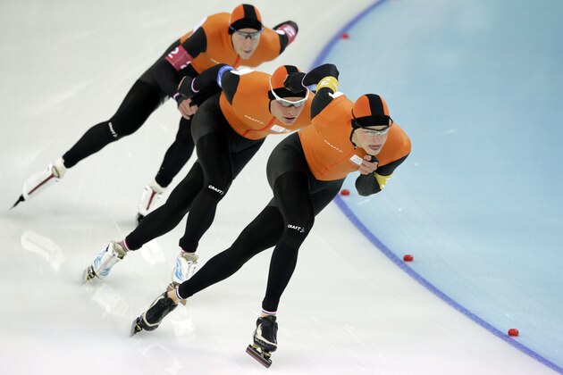 Speedskaters from the Netherlands, front to back, Sven Kramer, Koen Verweij, and Jan Blokhuijsen compete in the men's speedskating team pursuit semifinal race at the Adler Arena Skating Center at the 2014 Winter Olympics, Friday, Feb. 21, 2014, in Sochi, Russia. (AP Photo/Matt Dunham)
