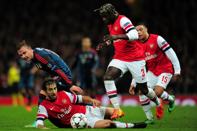 LONDON, ENGLAND - FEBRUARY 19: Mario Goetze of Bayern Muenchen clashes with Mathieu Flamini and Bacary Sagna of Arsenal during the UEFA Champions League Round of 16 first leg match between Arsenal and FC Bayern Muenchen at Emirates Stadium on February 19, 2014 in London, England. (Photo by Shaun Botterill/Getty Images) LONDON, ENGLAND - FEBRUARY 19: Mario Goetze of Bayern Muenchen clashes with Mathieu Flamini and Bacary Sagna of Arsenal during the UEFA Champions League Round of 16 first leg match between Arsenal and FC Bayern Muenchen at Emirates Stadium on February 19, 2014 in London, England. (Photo by Shaun Botterill/Getty Images)