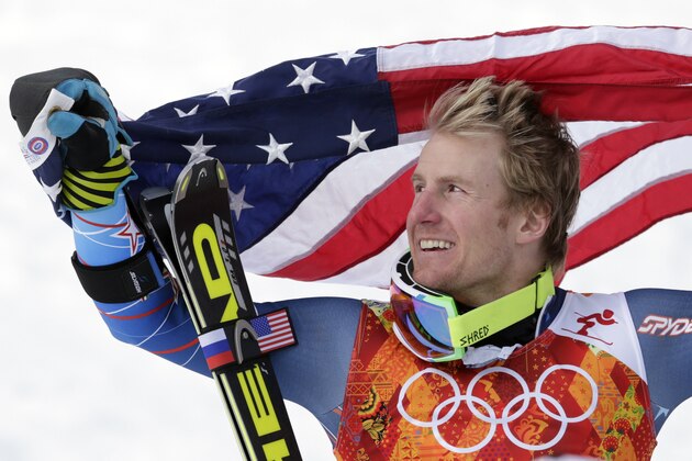 Men's giant slalom gold medalist Ted Ligety of the United States poses for photographers with the American flag on the podium at the Sochi 2014 Winter Olympics, Wednesday, Feb. 19, 2014, in Krasnaya Polyana, Russia.(AP Photo/Charles Krupa) Men's giant slalom gold medalist Ted Ligety of the United States poses for photographers with the American flag on the podium at the Sochi 2014 Winter Olympics, Wednesday, Feb. 19, 2014, in Krasnaya Polyana, Russia.(AP Photo/Charles Krupa)