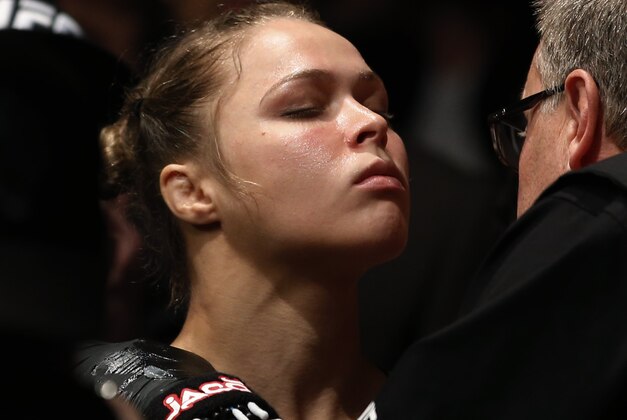 Ronda Rousey gets ready for her UFC 157 women's bantamweight championship mixed martial arts match with Liz Carmouche in Anaheim, Calif., Saturday, Feb. 23, 2013. Rousey won by tapout in the first round. (AP Photo/Jae C. Hong) Ronda Rousey gets ready for her UFC 157 women's bantamweight championship mixed martial arts match with Liz Carmouche in Anaheim, Calif., Saturday, Feb. 23, 2013. Rousey won by tapout in the first round. (AP Photo/Jae C. Hong)