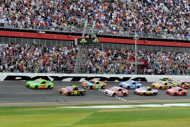 Feb 24, 2013; Daytona Beach, FL, USA; NASCAR Sprint Cup Series driver Danica Patrick (10) and Jeff Gordon (24) lead the field to the green flag at the start of the 2013 Daytona 500 at Daytona International Speedway. Mandatory Credit: Sam Sharpe-USA TODAY Sports