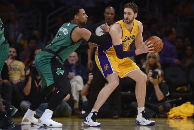 Feb 21, 2014; Los Angeles, CA, USA; Los Angeles Lakers center Pau Gasol (16) holds the ball as Boston Celtics center Jared Sullinger (7) defends during the first quarter at Staples Center. Mandatory Credit: Kelvin Kuo-USA TODAY Sports