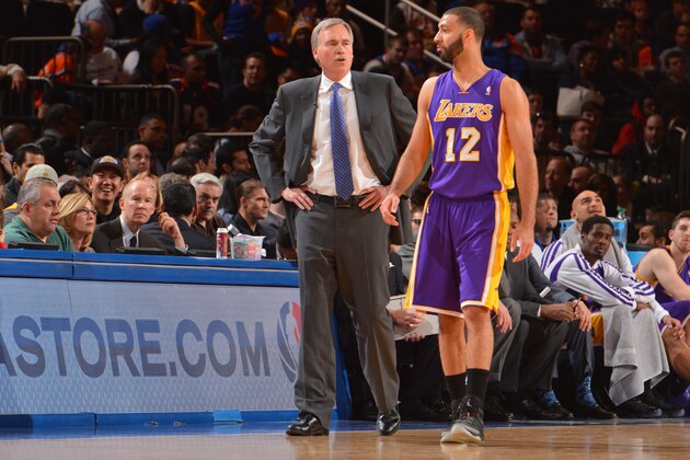 NEW YORK, NY - JANUARY 26: Head Coach Mike D'Antoni and Kendall Marshall #12 of the Los Angeles Lakers talk on court during the game against the New York Knicks at Madison Square Garden on January 26, 2014 in New York, New York. NOTE TO USER: User expressly acknowledges and agrees that, by downloading and or using this photograph, User is consenting to the terms and conditions of the Getty Images License Agreement. Mandatory Copyright Notice: Copyright 2014 NBAE (Photo by Jesse D. Garrabrant/NBAE via Getty Images)