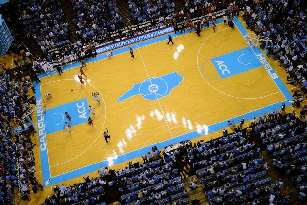 CHAPEL HILL, NC - DECEMBER 18:  General view as Marcus Paige #5 of the North Carolina Tar Heels falls to the floor after missing a last-second 3-point attempt as the Texas Longhorns celebrate after their win at the Dean Smith Center on December 18, 2013 in Chapel Hill, North Carolina. Texas won 86-83.  (Photo by Grant Halverson/Getty Images)