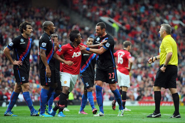 MANCHESTER, ENGLAND - SEPTEMBER 14: Damien Delaney of Crystal Palace confronts Anderson of Manchester United during the Barclays Premier League match between Manchester United and Crystal Palace at Old Trafford on September 14, 2013 in Manchester, England. (Photo by Michael Regan/Getty Images) MANCHESTER, ENGLAND - SEPTEMBER 14: Damien Delaney of Crystal Palace confronts Anderson of Manchester United during the Barclays Premier League match between Manchester United and Crystal Palace at Old Trafford on September 14, 2013 in Manchester, England. (Photo by Michael Regan/Getty Images)