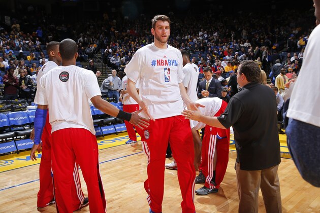 OAKLAND, CA - FEBRUARY 10: Spencer Hawes #00 of the Philadelphia 76ers gets introduced into the starting lineup against the Golden State Warriors on February 10, 2014 at Oracle Arena in Oakland, California. NOTE TO USER: User expressly acknowledges and agrees that, by downloading and or using this photograph, user is consenting to the terms and conditions of Getty Images License Agreement. Mandatory Copyright Notice: Copyright 2014 NBAE (Photo by Rocky Widner/NBAE via Getty Images)