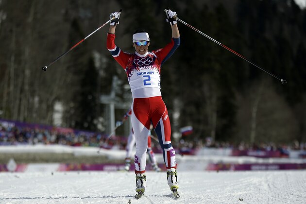 Norway's Marit Bjoergen celebrates after winning the gold medal in the women's 30K cross-country race at the 2014 Winter Olympics, Saturday, Feb. 22, 2014, in Krasnaya Polyana, Russia. (AP Photo/Gregorio Borgia)