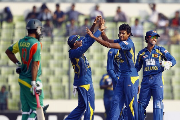 Sri Lanka’s Suranga Lakmal, second right, celebrates with teammates the dismissal of Bangladesh’s Nasir Hossain on the third one day international cricket in Dhaka, Bangladesh, Saturday, Feb. 22, 2014. (AP Photo/A.M. Ahad) Sri Lanka’s Suranga Lakmal, second right, celebrates with teammates the dismissal of Bangladesh’s Nasir Hossain on the third one day international cricket in Dhaka, Bangladesh, Saturday, Feb. 22, 2014. (AP Photo/A.M. Ahad)