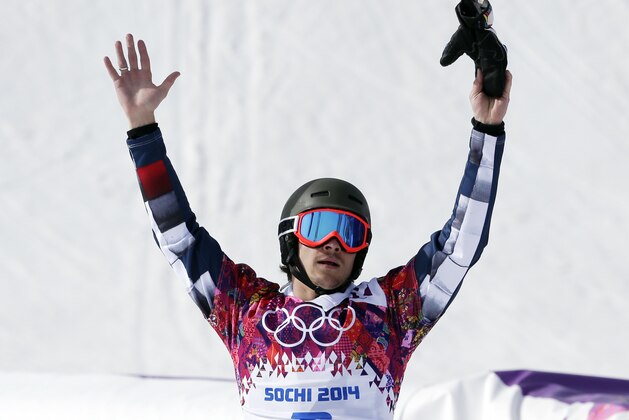 Russia's Vic Wild celebrates his gold medal in the men's snowboard parallel slalom final at the Rosa Khutor Extreme Park, at the 2014 Winter Olympics, Saturday, Feb. 22, 2014, in Krasnaya Polyana, Russia. (AP Photo/Andy Wong)