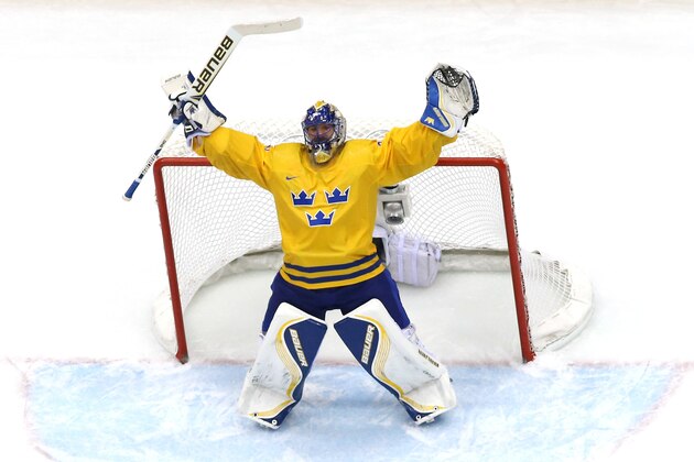 SOCHI, RUSSIA - FEBRUARY 21:  Henrik Lundqvist #30 of Sweden celebrates after defeating Finland 2-1 during the Men's Ice Hockey Semifinal Playoff on Day 14 of the 2014 Sochi Winter Olympics at Bolshoy Ice Dome on February 21, 2014 in Sochi, Russia.  (Photo by Martin Rose/Getty Images)
