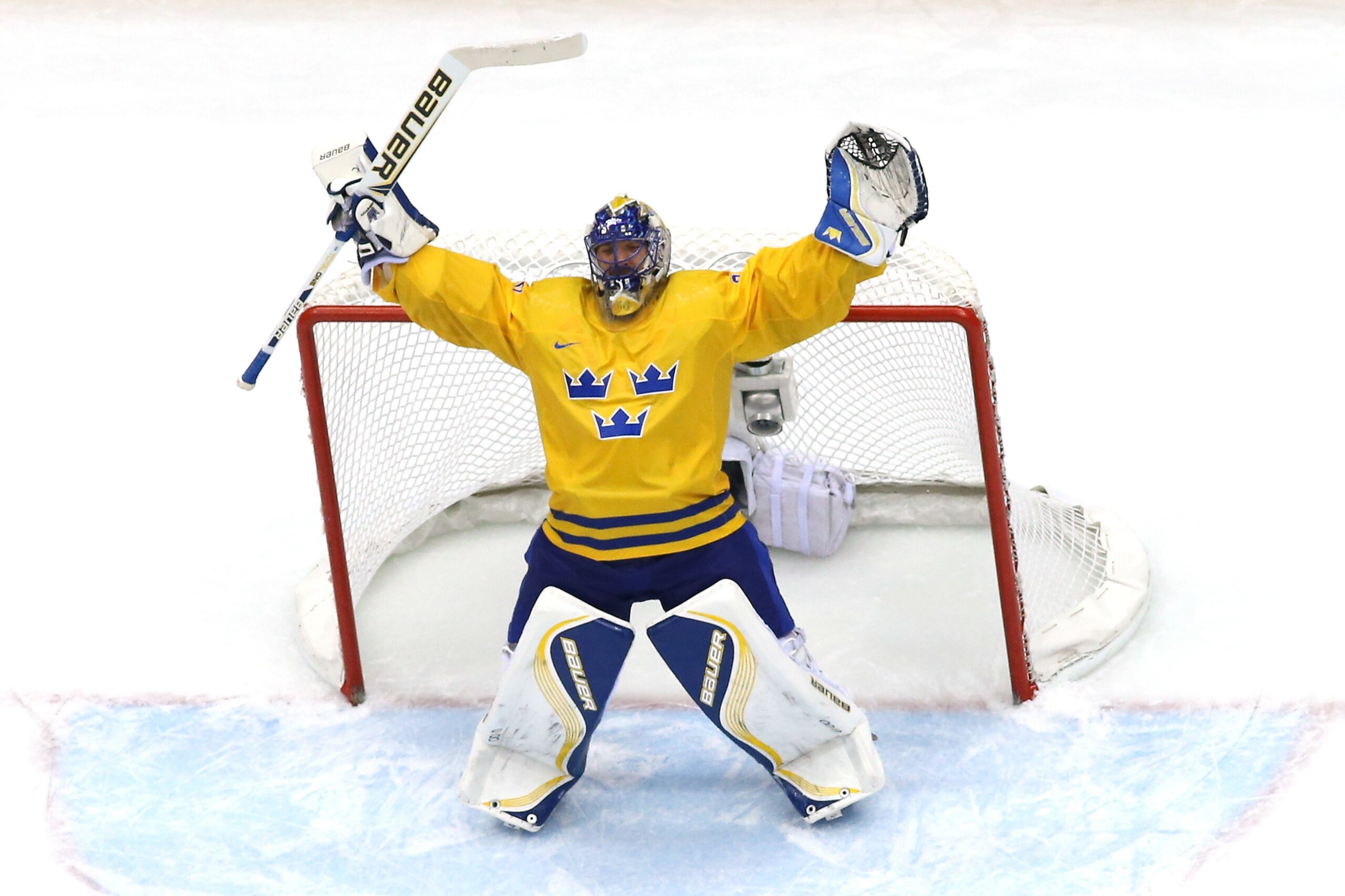 SOCHI, RUSSIA - FEBRUARY 21:  Henrik Lundqvist #30 of Sweden celebrates after defeating Finland 2-1 during the Men's Ice Hockey Semifinal Playoff on Day 14 of the 2014 Sochi Winter Olympics at Bolshoy Ice Dome on February 21, 2014 in Sochi, Russia.  (Photo by Martin Rose/Getty Images)