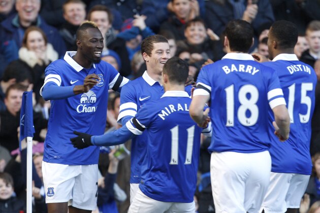 Everton's Lacina Traore, left, celebrates with teammates after scoring against Swansea City during their English FA Cup fifth round soccer match at Goodison Park Stadium, Liverpool, England, Sunday Feb. 16, 2014. (AP Photo/Jon Super)