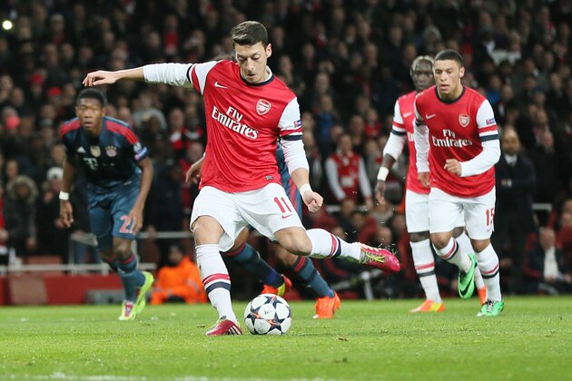 Arsenal's Mesut Ozil misses to score with a penalty during a Champions League, round of 16, first leg soccer match between Arsenal and Bayern Munich at the Emirates stadium in London, Wednesday, Feb. 19, 2014 .(AP Photo/Alastair Grant)