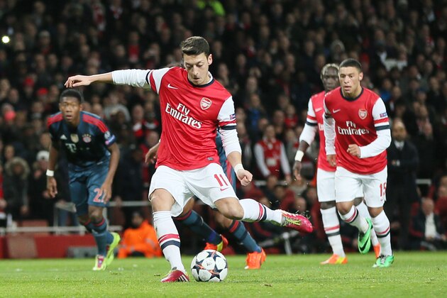 Arsenal's Mesut Ozil misses to score with a penalty during a Champions League, round of 16, first leg soccer match between Arsenal and Bayern Munich at the Emirates stadium in London, Wednesday, Feb. 19, 2014 .(AP Photo/Alastair Grant)